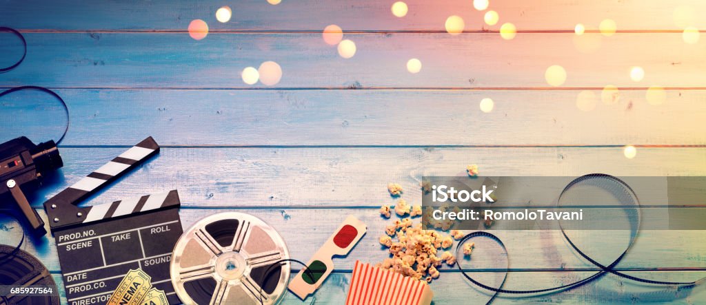 Cinema Film Background Camera With Clapperboard, Tickets, Rolls, Glasses And Popcorn Movie Stock Photo
