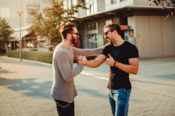 istock Old friends meet and laughing while shaking hands 685927604