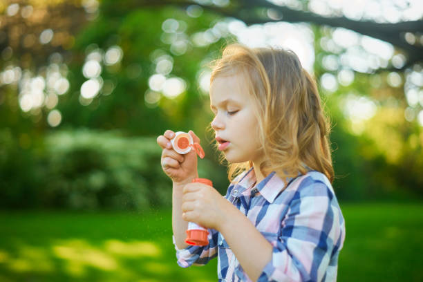 istock Girl and soap bubbles 685930374