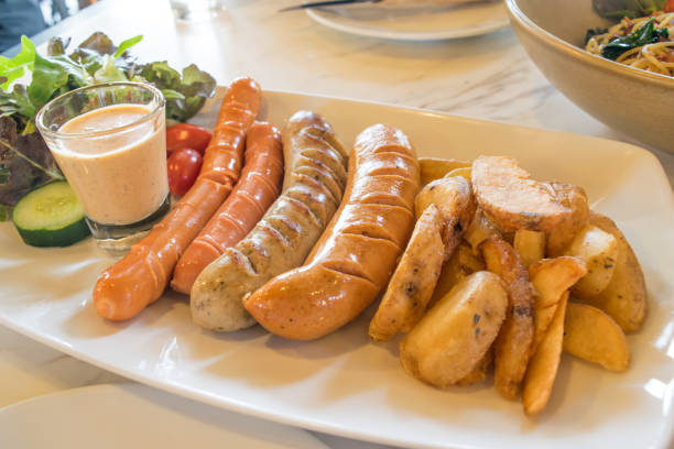 istock Grilled mix sausage with fried potato and vegetables 685933876