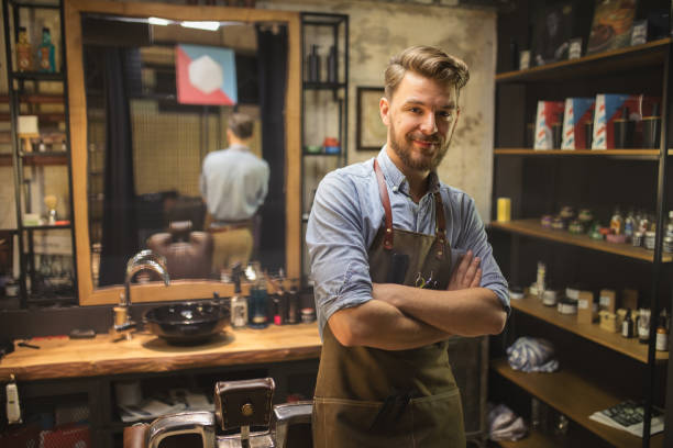 Barber at his salon stock photo