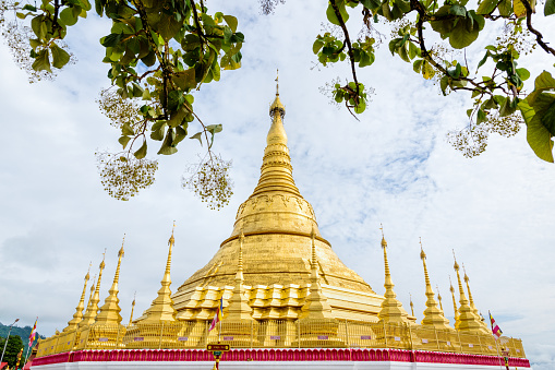 Tachileik Shwedagon Pagoda is a beautiful golden pagoda that imitates Shwedagon Paya Pagoda, tourist attraction near the Thai border at Tachileik town in Shan State, Myanmar (Burma)