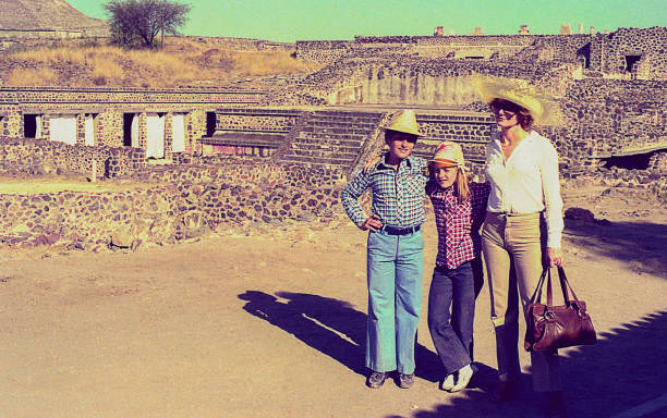 Vintage family trip to Mexico Vintage photo featuring a mother and her children in an archeological site during a trip to Mexico in the eighties. latin american and hispanic culture photos stock pictures, royalty-free photos & images