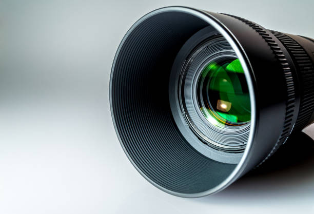istock Lens of a SLR camera close-up with a reflection on a grey-white background 685964826