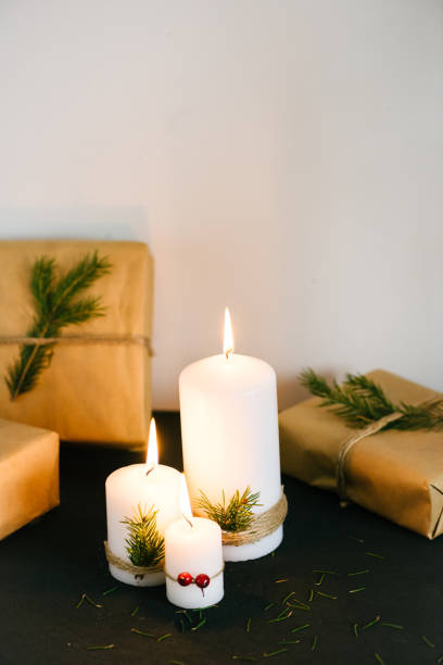 istock Christmas decorations with lit candles and gift boxes 685967470