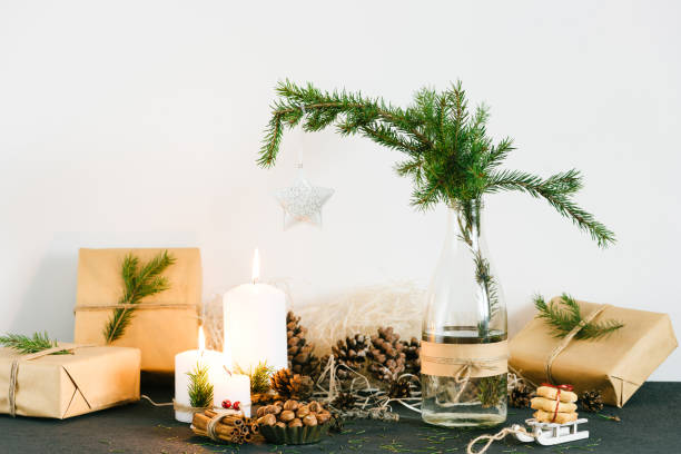 istock Christmas decorations with lit candles and gift boxes 685967524