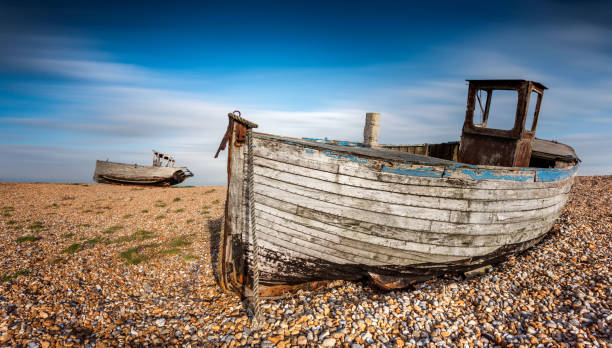 istock Two boats stranded on a pebbled beach. Dungeness, England 685991270