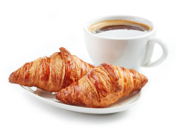 istock fresh croissants and coffee cup 685991352