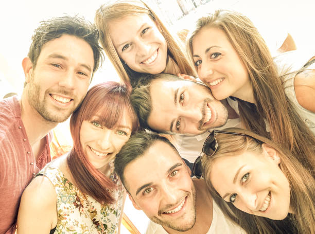 istock Happy best friends taking selfie outdoors with spring time backlighting - Friendship and happiness concept with young people having fun together - Warm vintage filter with bright sunshine color tones 685993828