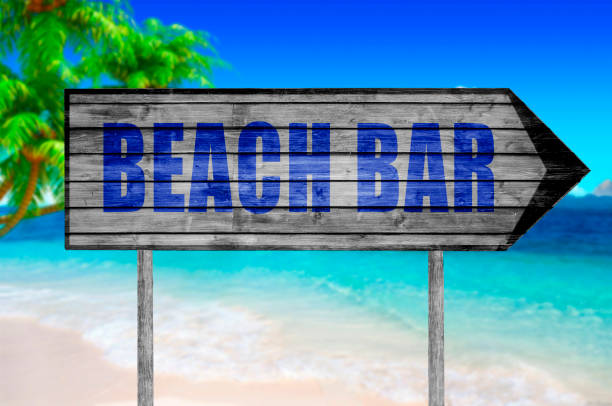 istock Beach Bar wooden sign with on a beach 686002182