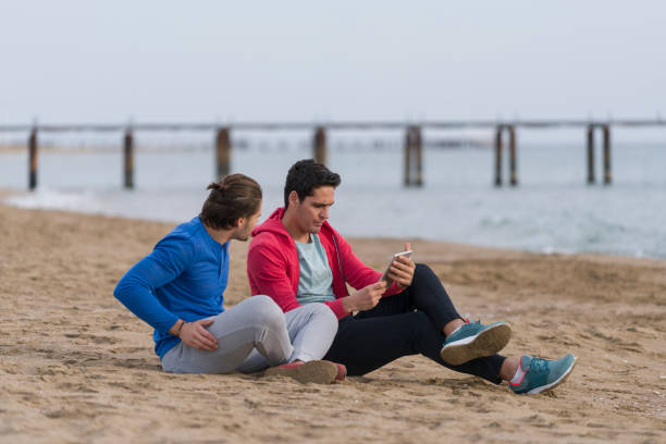 istock Two Friends On The Beach Together 686004774