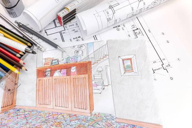 istock hand drawn sketches and blueprint rolls for modern room interior and drawing tools on designers workplace 686016830