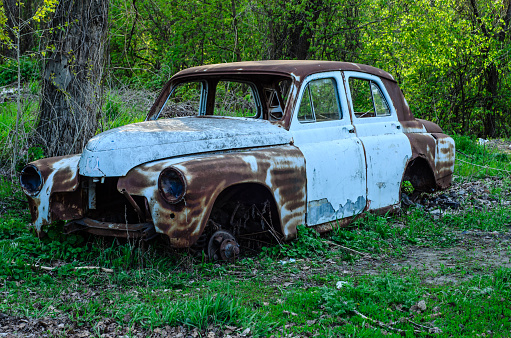 Old rusty car body on a ground