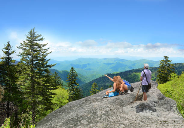 istock Family hiking on vacation in summer mountains. 686020084