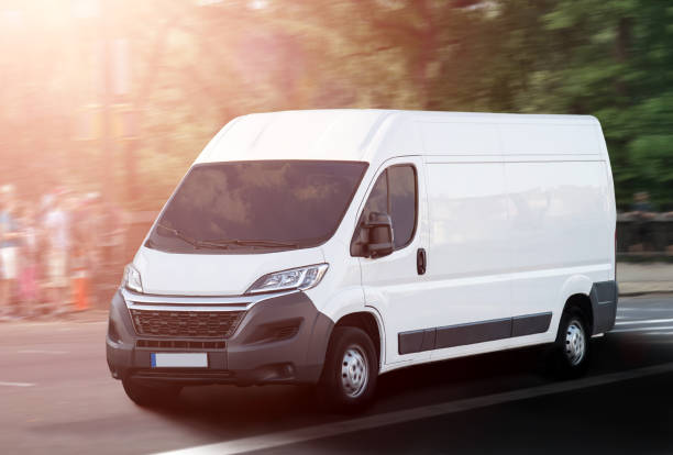 istock white van / delivery truck on street in evening sunlight 686023700