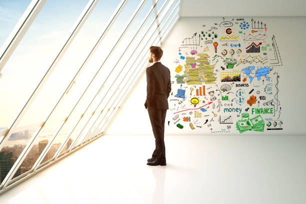 istock Man in room with business sketch 686023750
