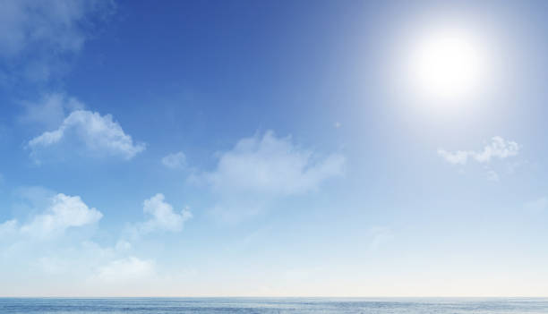 istock clear blue sky and sun above calm ocean water 686026378