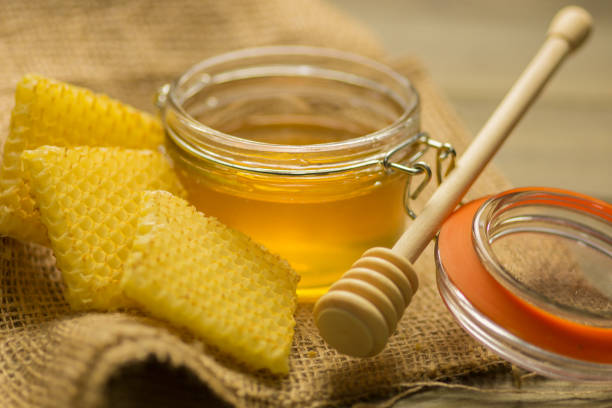 istock Glass with golden honey 686027512