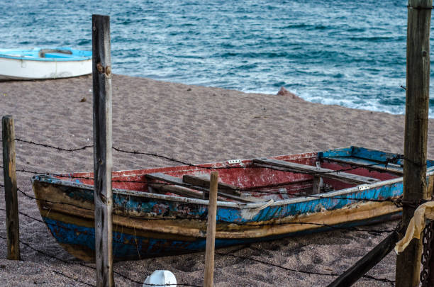 istock Small fishing boat on the sand 686029752