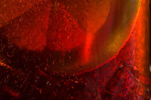 Detail of Cold Bubbly Carbonated Soft Drink with Ice and lemon