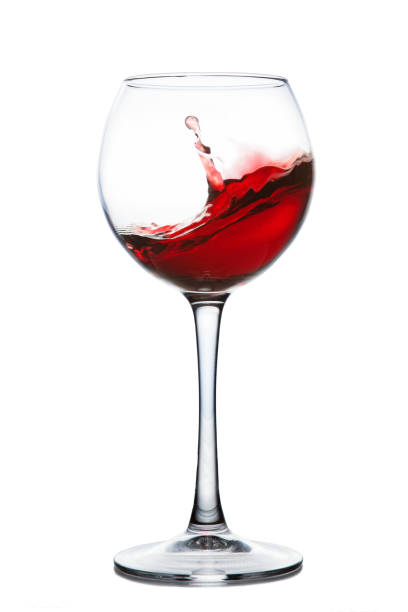 istock Red wine splashing in a glass 686045300