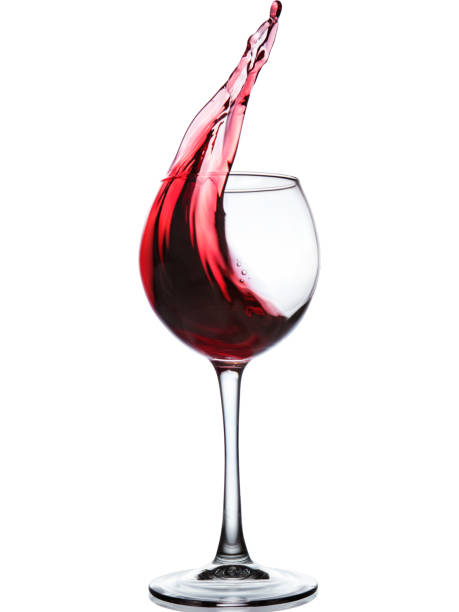 istock Red wine splashing in a glass 686045346