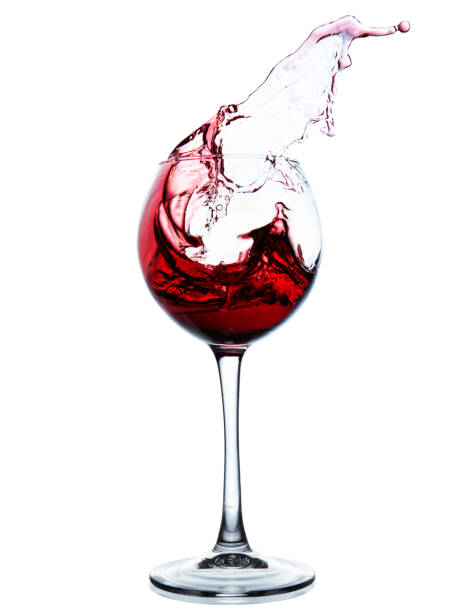 istock Red wine splashing in a glass 686047312