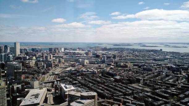 istock overview of city looking toward bay with clouds 686063370
