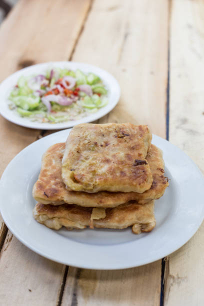 istock Roti Parata or Roti canai with curry sauce 686074316