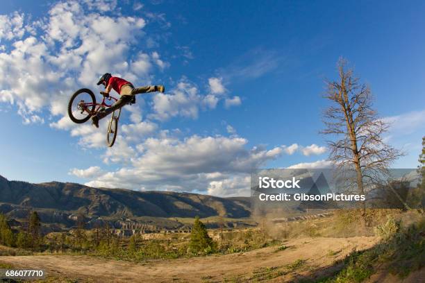 A Young Man Does A Nac Nac Trick On His Downhillstyle Mountain Bike Stock Photo - Download Image Now
