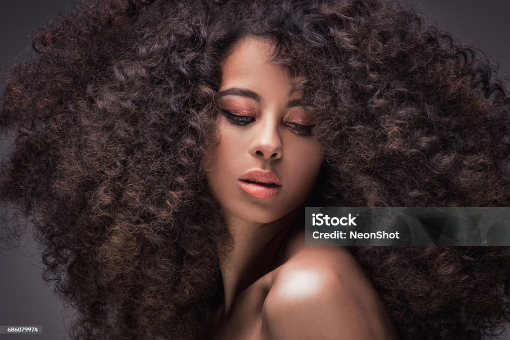 Beauty portrait of african girl. Beauty portrait of sensual african american woman with long curly hair . Fashion Model Stock Photo