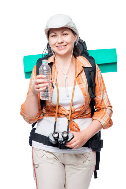 portrait of a tourist with a water bottle and backpack on a white background portrait of a tourist with a water bottle and backpack on a white background voyager 1 stock pictures, royalty-free photos & images