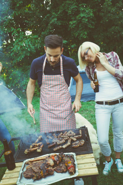 istock Young couple in nature preparing food 686103290