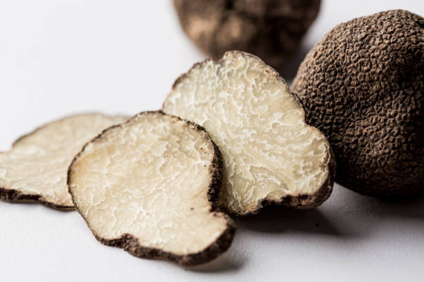 Black truffles and slices on black