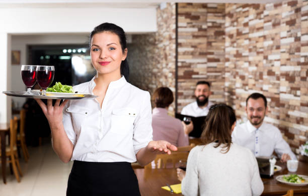 istock Female waiter showing country restaurant 686114794