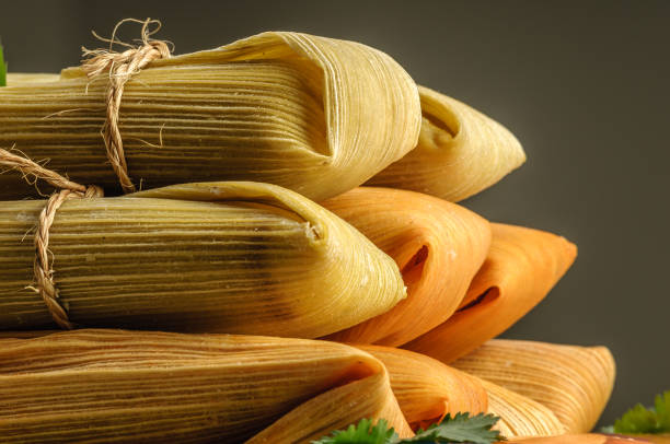 Mexican tamales made of corn and chicken stock photo