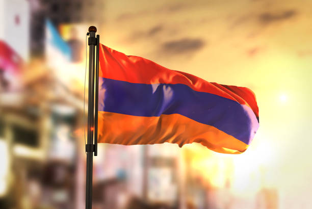 istock Armenia Flag Against City Blurred Background At Sunrise Backlight 686124330