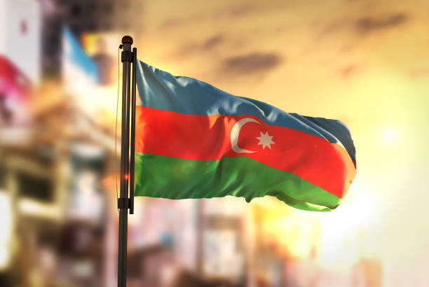 istock Azerbaijan Flag Against City Blurred Background At Sunrise Backlight 686124374