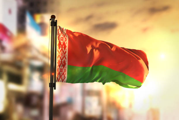istock Belarus Flag Against City Blurred Background At Sunrise Backlight 686124454