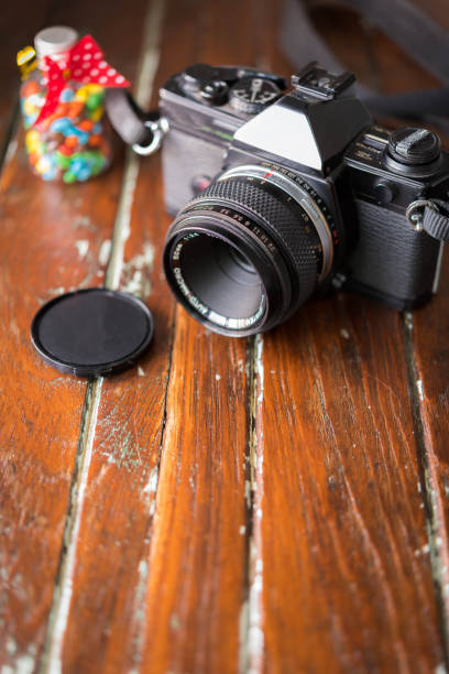 istock Vintage photo camera on a wooden table 686127732
