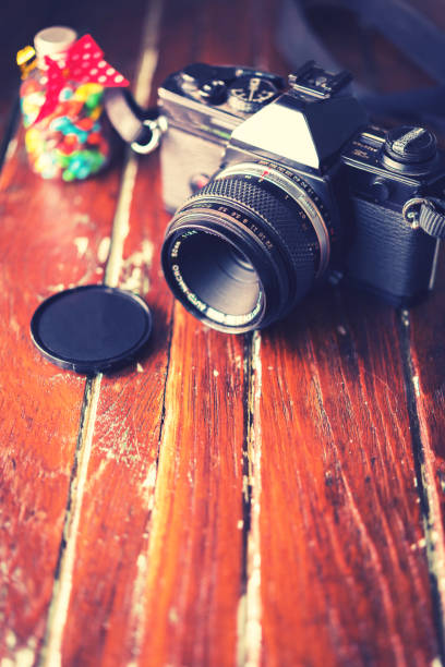 istock Vintage photo camera on a wooden table 686130028