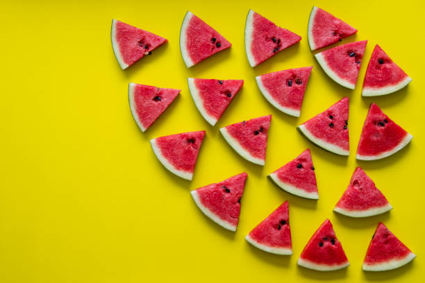 istock Pieces of red watermelon on yellow background. 686130260