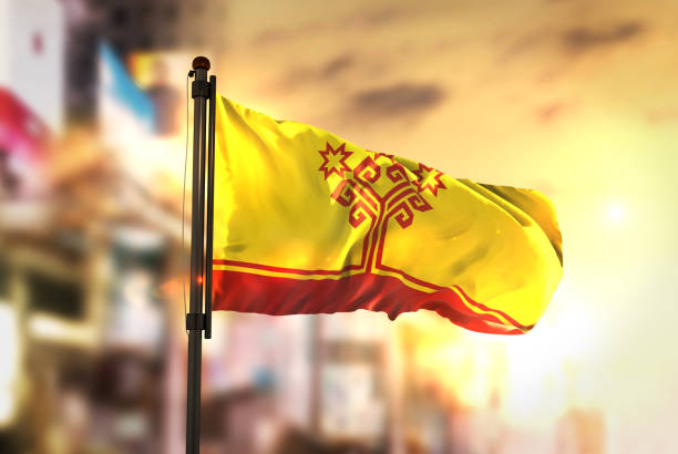 istock Chuvashia Flag Against City Blurred Background At Sunrise Backlight 686136882