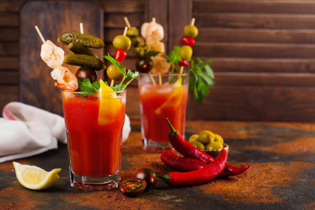 Bloody mary cocktail with garnish Homemade spicy vodka bloody mary cocktail bloody mary stock pictures, royalty-free photos & images