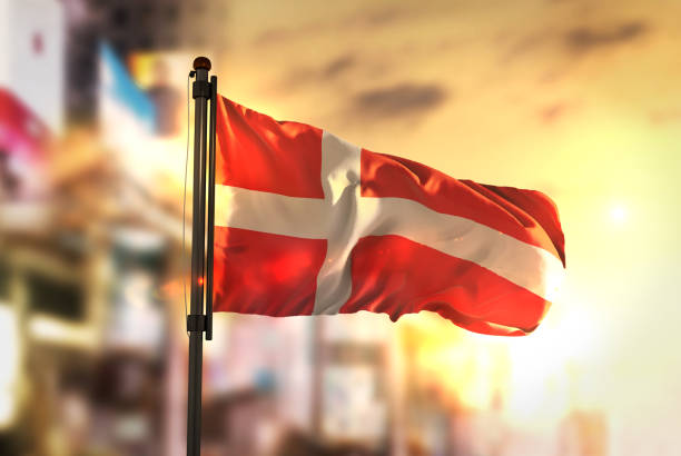 istock Denmark Flag Against City Blurred Background At Sunrise Backlight 686139360