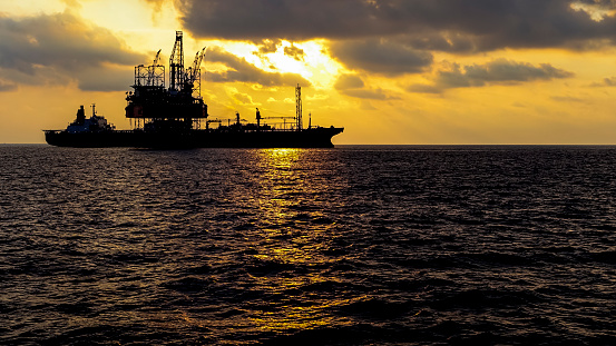 Oil platform and FPSO ship in sunset, Malaysia