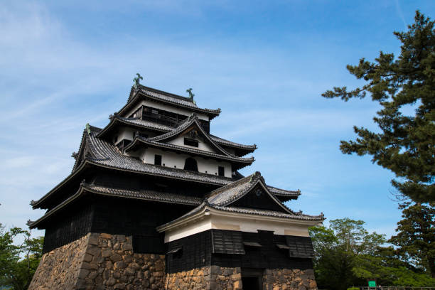 Matsue, Shimane Prefecture, Japan - May 8, 2017: Matsue castle is one of the 12 original castles and also 5 castles designated as National Treasure in Japan. It was built in 1611 by Horio Yoshiharu who governed the region of the present Shimane Prefecture. Wooden castle tower was constructed in four sections with five floors.