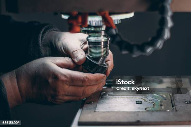 Hands Of Worker Changing Cutter In Cnc Milling Machine Stock Photo - Download Image Now