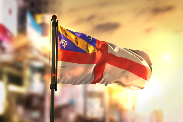 istock Herm Flag Against City Blurred Background At Sunrise Backlight 686156050