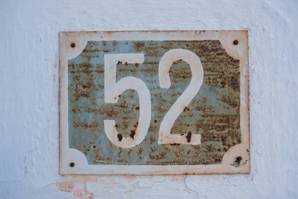 istock Very old rusty house number 52 plate 686167938